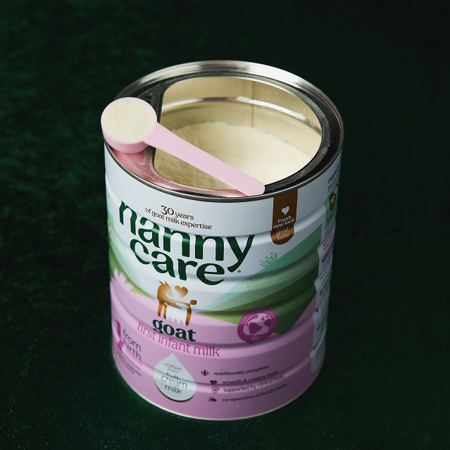 Open tin of Nannycare Stage 1 goat milk formula with scoop