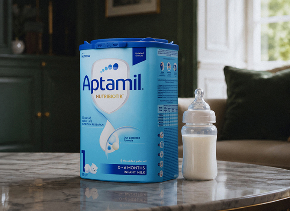 Aptamil Nutribiotik Stage 1 tin with a prepared bottle