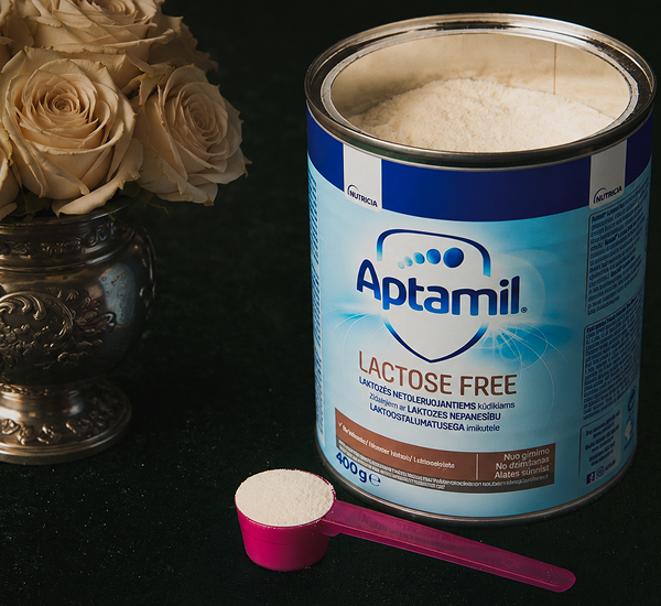 Aptamil Lactose Free tin with scoop