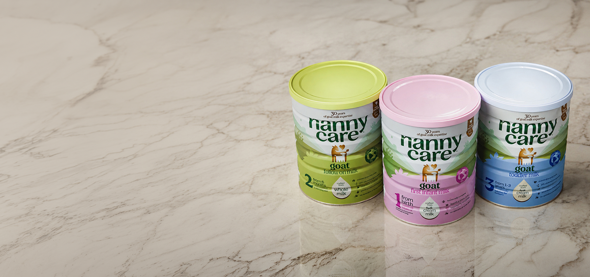 Nannycare goat milk formula Stage 1, 2 and 3 tins on marble
